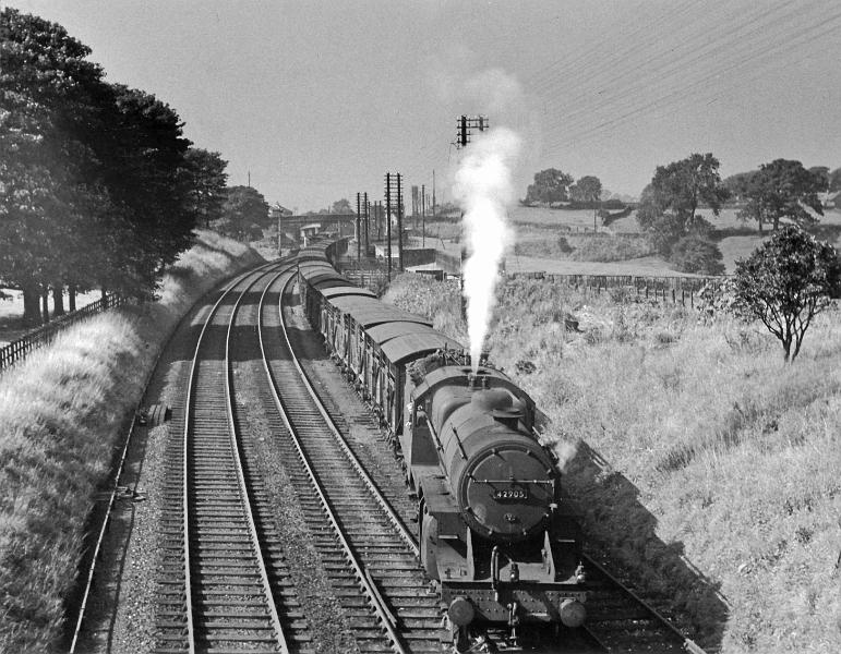 Loco 42905.jpg - Number  42905    - Crab 2-6-0 -  Designed by George Hughes  - Built Sept 1930 at  Crewe Works  for the LMS Railway.    Photographed on 6th October 1956, after picking up cattle at the Long Preston cattle dock.  A total of 245 Crabs were built between 1926 and 1932 at Horwich and Crewe; they were designed for mixed traffic. It was shedded at Carlisle Kingmoor in 1948. Its last shed was Newton Heath.  Withdrawn from service in July 1965 & disposed of in Feb 1966.